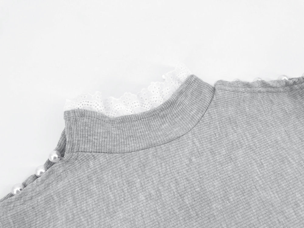 Pull à col roulé en dentelle avec perles creuses