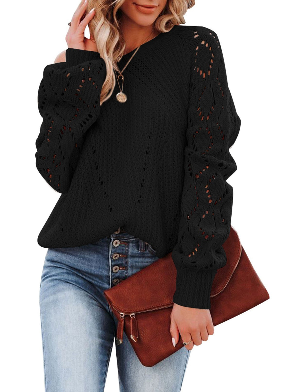 Pull col rond uni à motif creux
