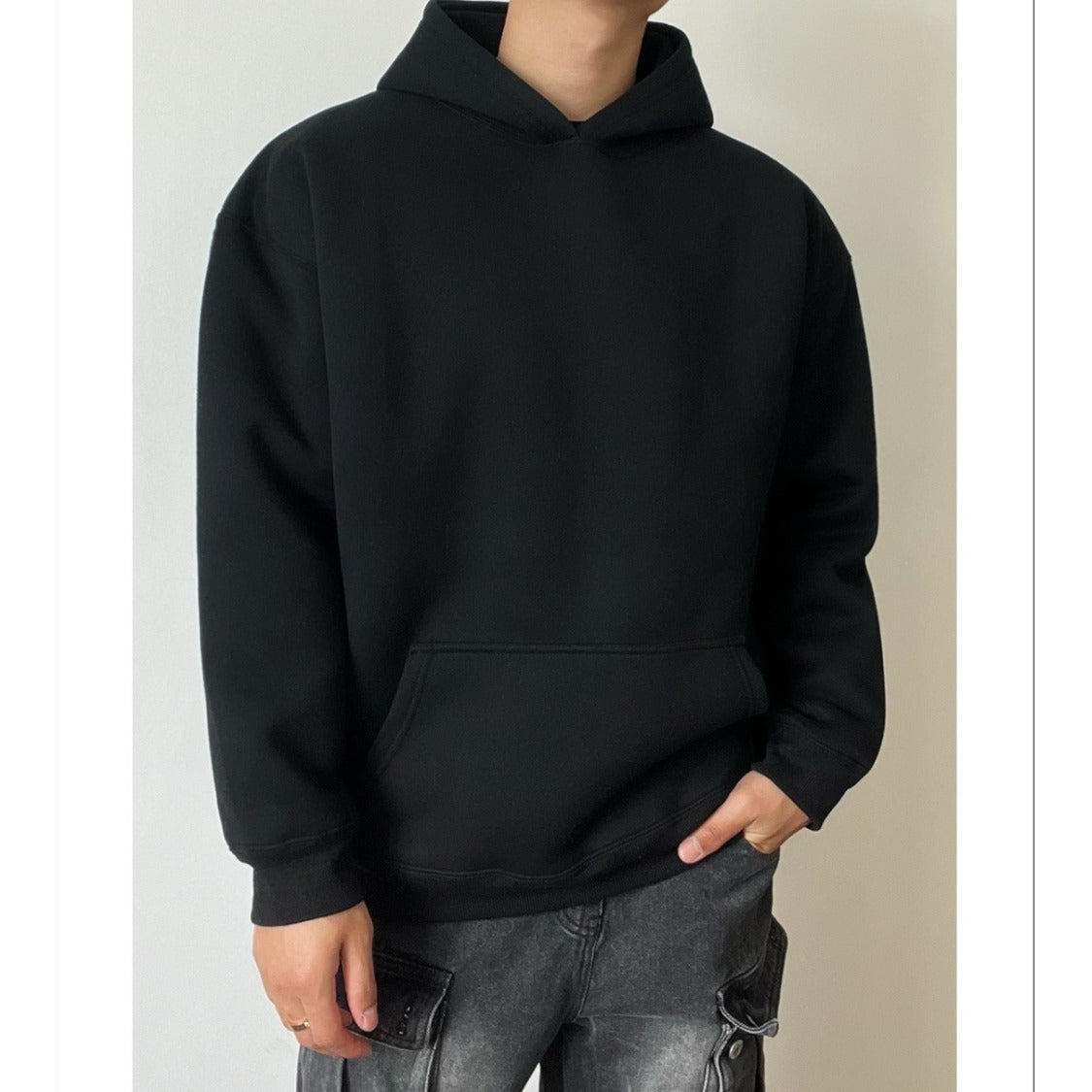 Pull à capuche de couleur unie