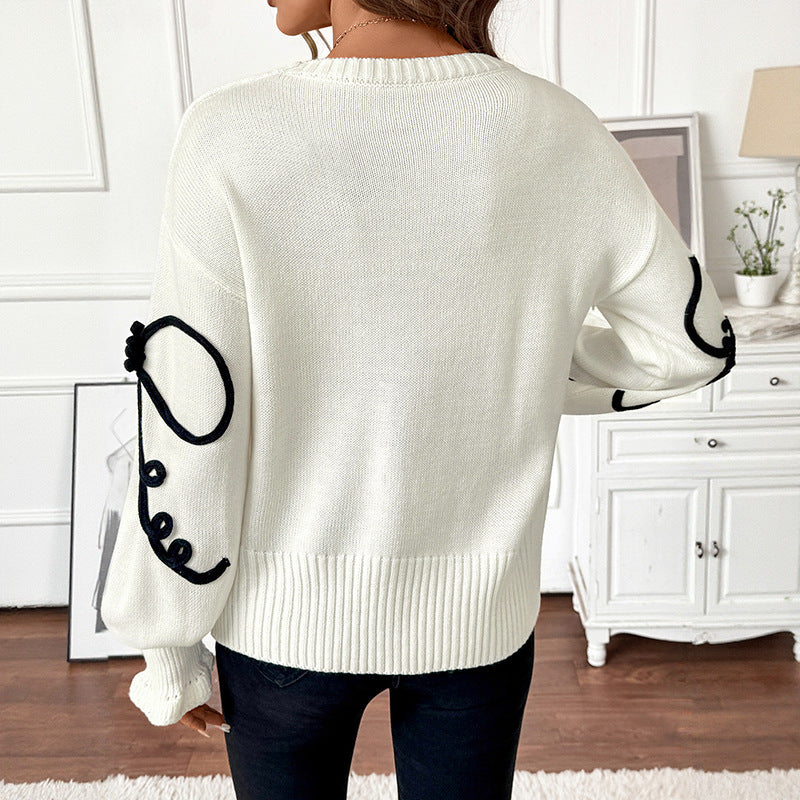 Pull col rond décoratif à nœud ample