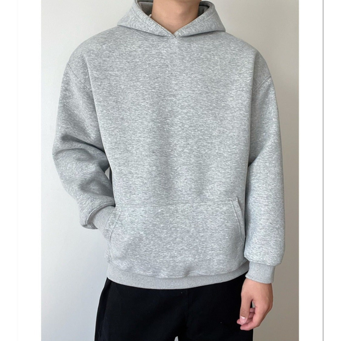 Pull à capuche de couleur unie