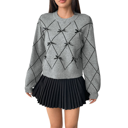 Pull tricoté avec nœud décoratif