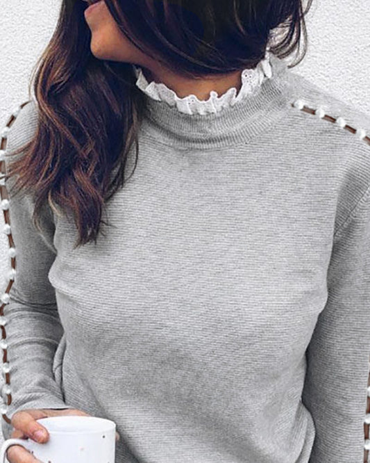 Pull à col roulé en dentelle avec perles creuses