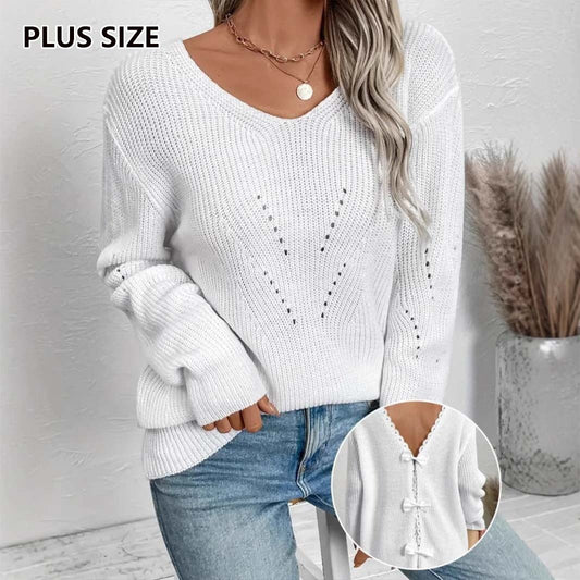 Pull élégant à col rond, découpes en dentelle, coutures et nœud dans le dos