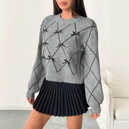 Pull tricoté avec nœud décoratif