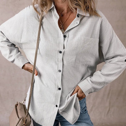 Chemise longue à rayures, manches retroussées et poches